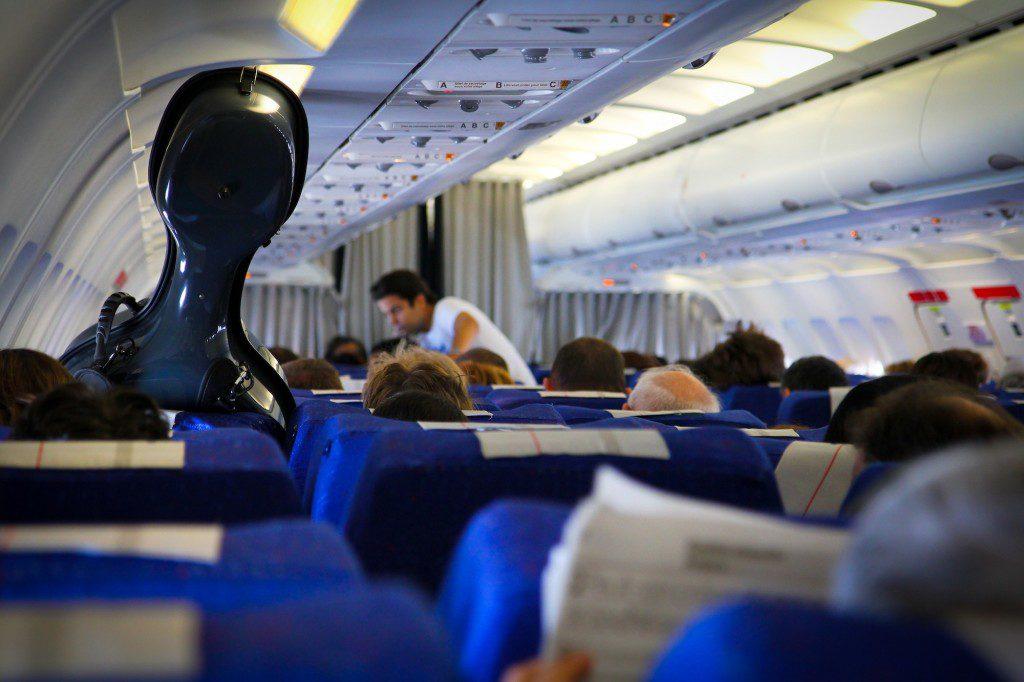 carry guitar on flight free of charge