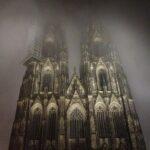 cologne cathedral facade in a foggy night