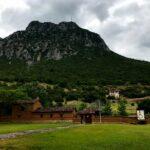 green rocky mountain under dismal black sky in gravia village in phokis, greece