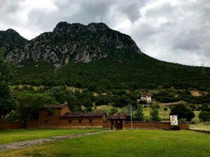 green rocky mountain under dismal black sky in gravia village in phokis, greece