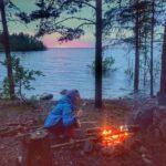 preparing food in bonfire at ladoga lake coast