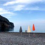 colorful parasols on heavenly beach limnionas on east euboea island in greece