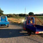 Blue italian three wheel vehicles in fields in marche