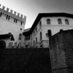 wall and castle in ostra, marche, italy black and white