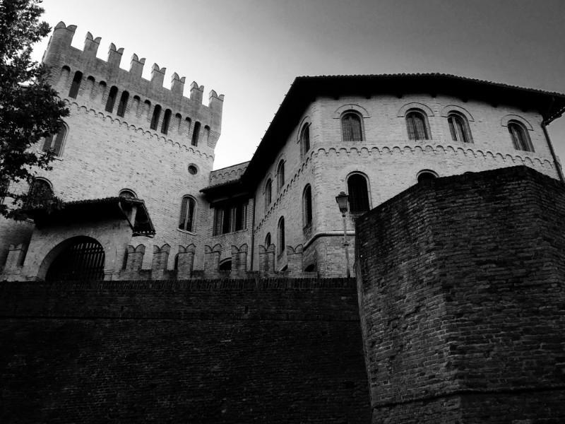 wall and castle in ostra, marche, italy black and white