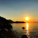 marvelous sunset from vamvakes beach on the coast of the corinthian gulf in greece