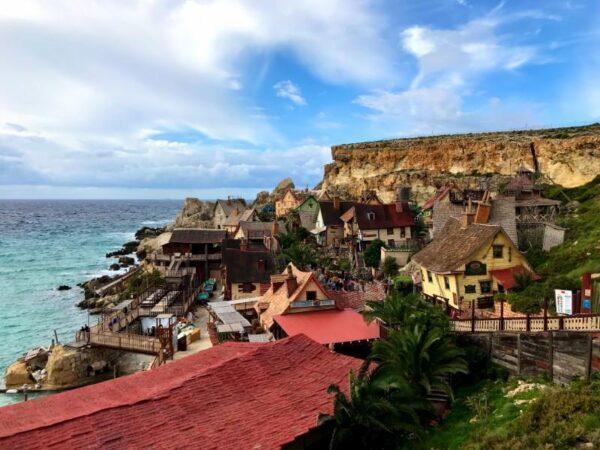 popeye village malta blue sky and green waters