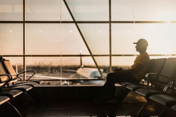 A woman walks past the closed check in counters of Ryanair at