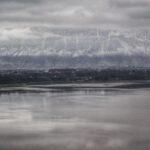 Snowy mountains and a lake in kukes, albania