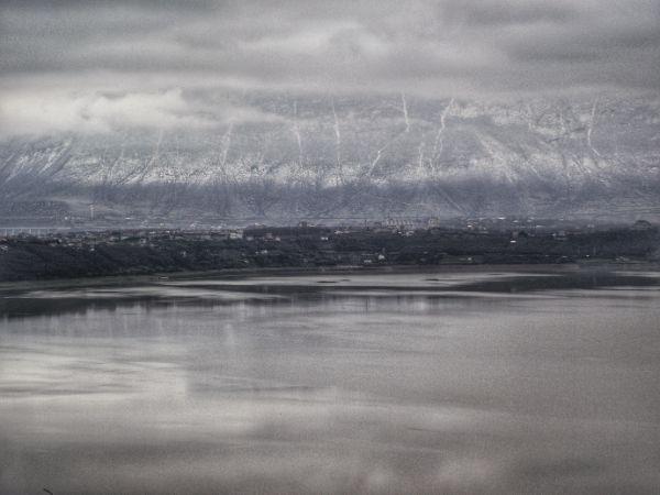 Snowy mountains and a lake in kukes, albania