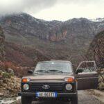 A car stood in front of rocky mountains in vukel, Shkoder County, albania