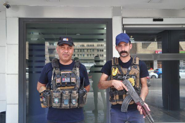 Machine-gun armed security guards in a bank in Baghdad, Iraq