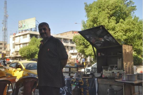 Kurdish street-food stall owner in Baghdad