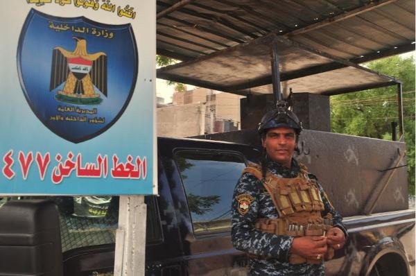 Iraqi soldier posing for a picture in Baghdad downtown