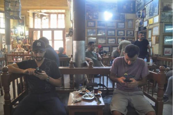 Tourists in Baghdad's Shabandar Cafe