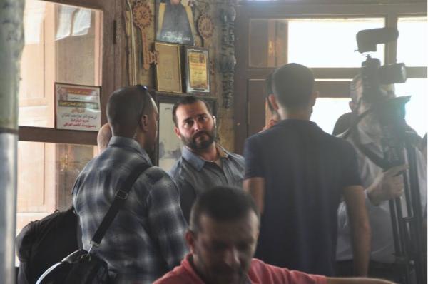 CIA or something American security agents in Baghdad preparing for US ambassador's honor visit to historic cafe