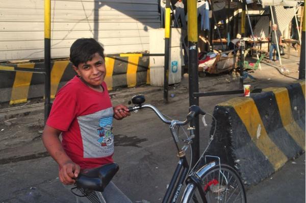Iraqi boy with bicycle