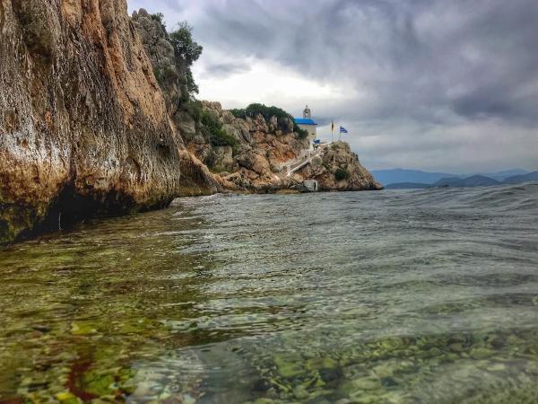 Wading the way through the sea to Agios Nikolaos church in nauplion greece