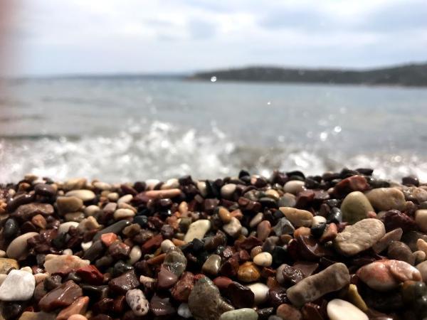 Wave-stricken pebbles at kondyli/agios nikolaos beach in nafplio greece