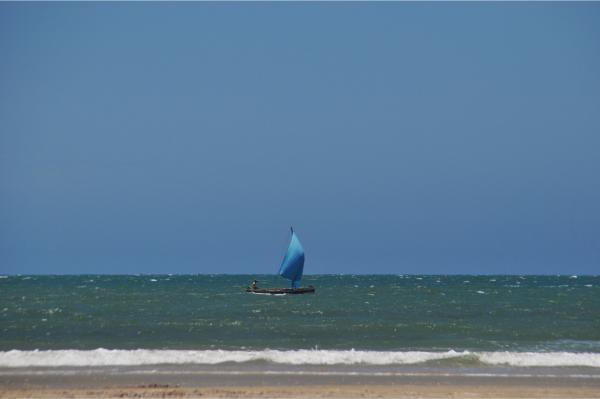 pirogue with full sail in morondava madagascar