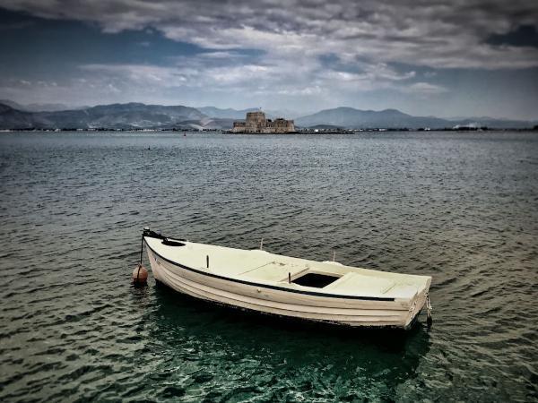 Boat and Burtzi Castle Island from the port of Nafplio