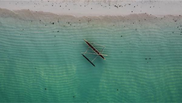 bird's eye drone view of pirogue at nosy ve beach in madagascar