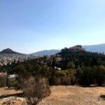 view of the acropolis and lycabettus hill from pnyx hill in athens, greece