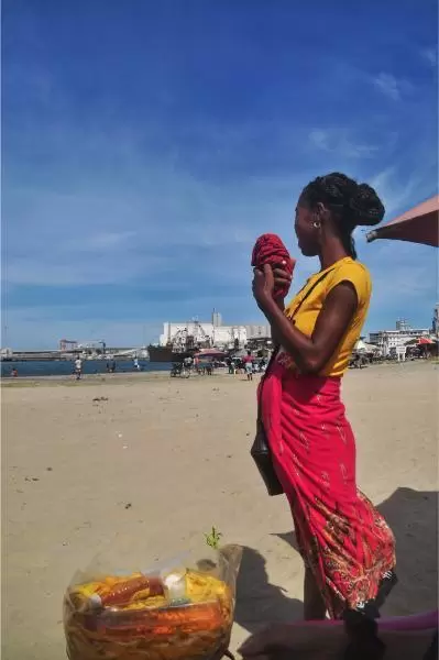 Mango vendor woman toamasina beach madagascar