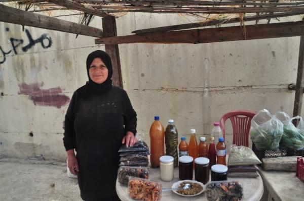 lebanese muslim woman selling food products on a roadside stall