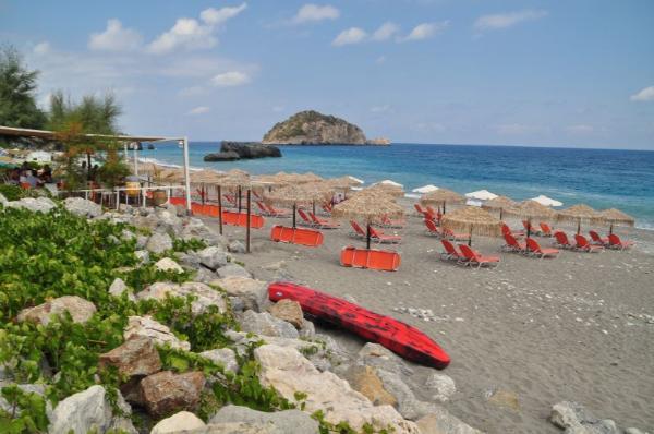 Sunbeds with view of the Aegean Sea at chiliadou beach, evia island