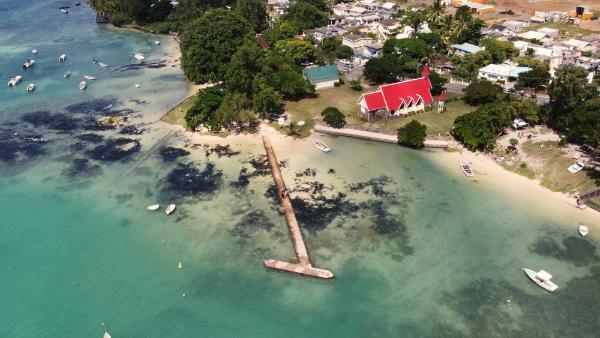 bird's eye drone view of Cap Malheureux beach and church in mauritius