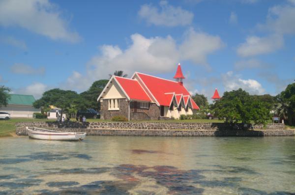 picturesque red-roofed church at the beach of cap malheureux in northern mauritius