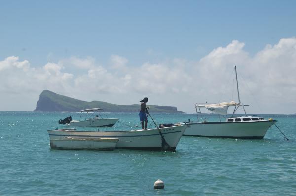 view of boats and Gunner's Quoin Island from the beach of cap malheureux