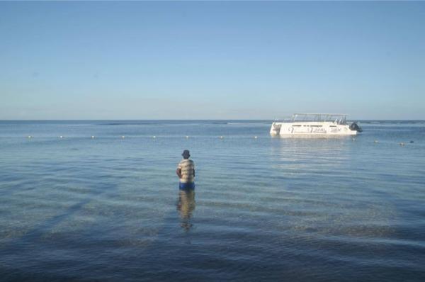 morning fisherman at balaclava beach in mauritius