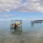 boats and sea view at blue bay public beach in mauritius