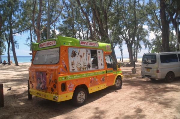 bright green and orange ice cream at flic en flac beach in mauritius