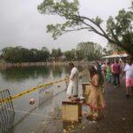 hindu pilgrims on shore of grand bassin lake in mauritius