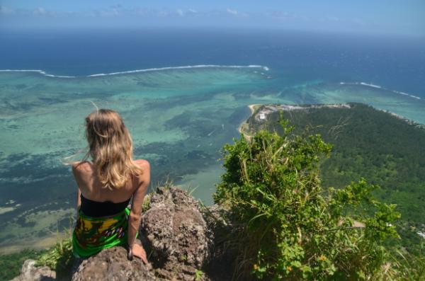 girl staring at the view from the top of le morne brabant, mauritius