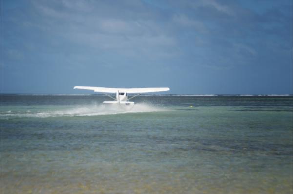 hydroplane taking off from the lagoon in mauritius