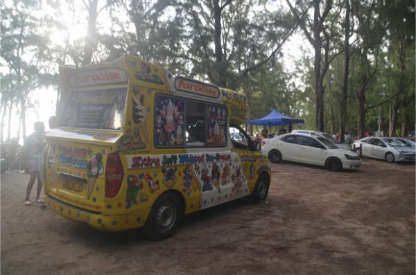 yellow Ice-cream truck at mont choisy beach, mauritius