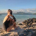 girl with camera at pointe d'esny beach in mauritius