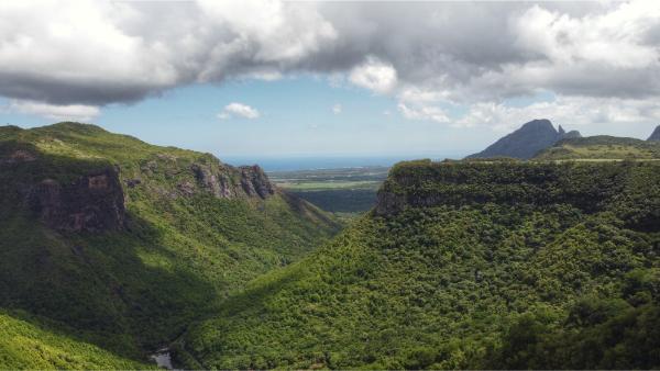 view of the lower tamarind gorge and the ocean from henrietta village in mauritius