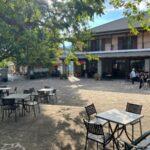 tables in the square of agia paraskevi (kerasovo) village on the foot of mount smolikas