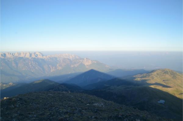 Sunrise pyramid shadow from the summit of mount smolikas