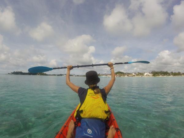 Sliding over crystalline lagoon of mauritius in a kayak