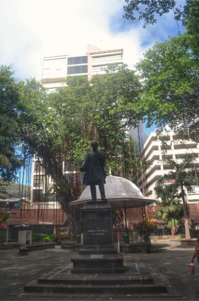 Some famous dude’s statue under the banyan trees in company garden port louis