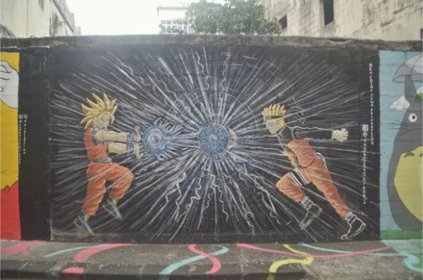 son goku firing dragon ball on a mural in port louis chinatown