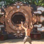 guy dancing in front of stage of psyland festival 2024 in vergina, greece