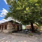 little traditional cafe under big tree in pyrsogianni stone village in epirus greece