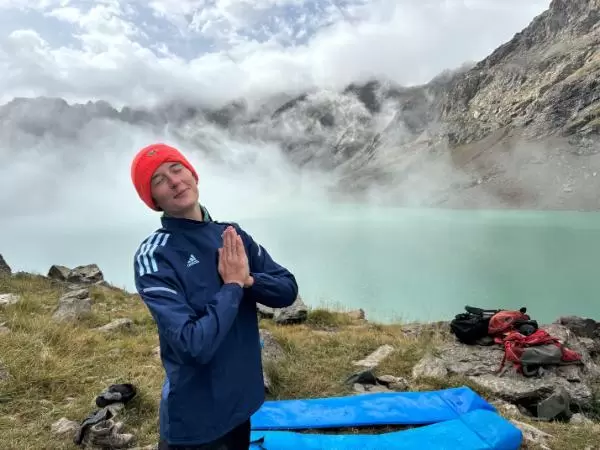 girl at misty morning ala kul lake in kyrgyzstan